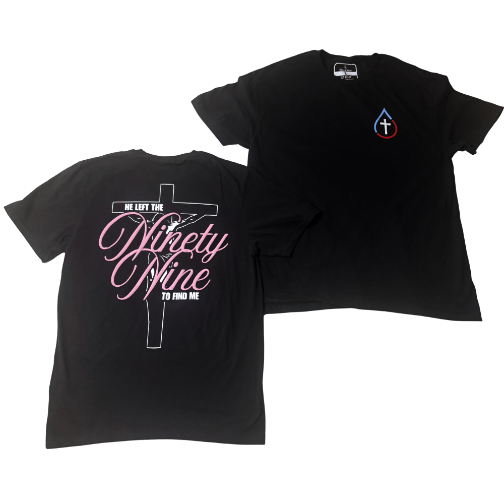 Two black short-sleeve t-shirts shown on a white background, displaying the front and back designs. The front shirt features a small white cross inside of a droplet drawn in blue and red to symbolize water and blood on the left chest, while the back shirt features a large graphic with a white crucifix and pink cursive overlaid text reading 'He Left the Ninety Nine to Find Me'.