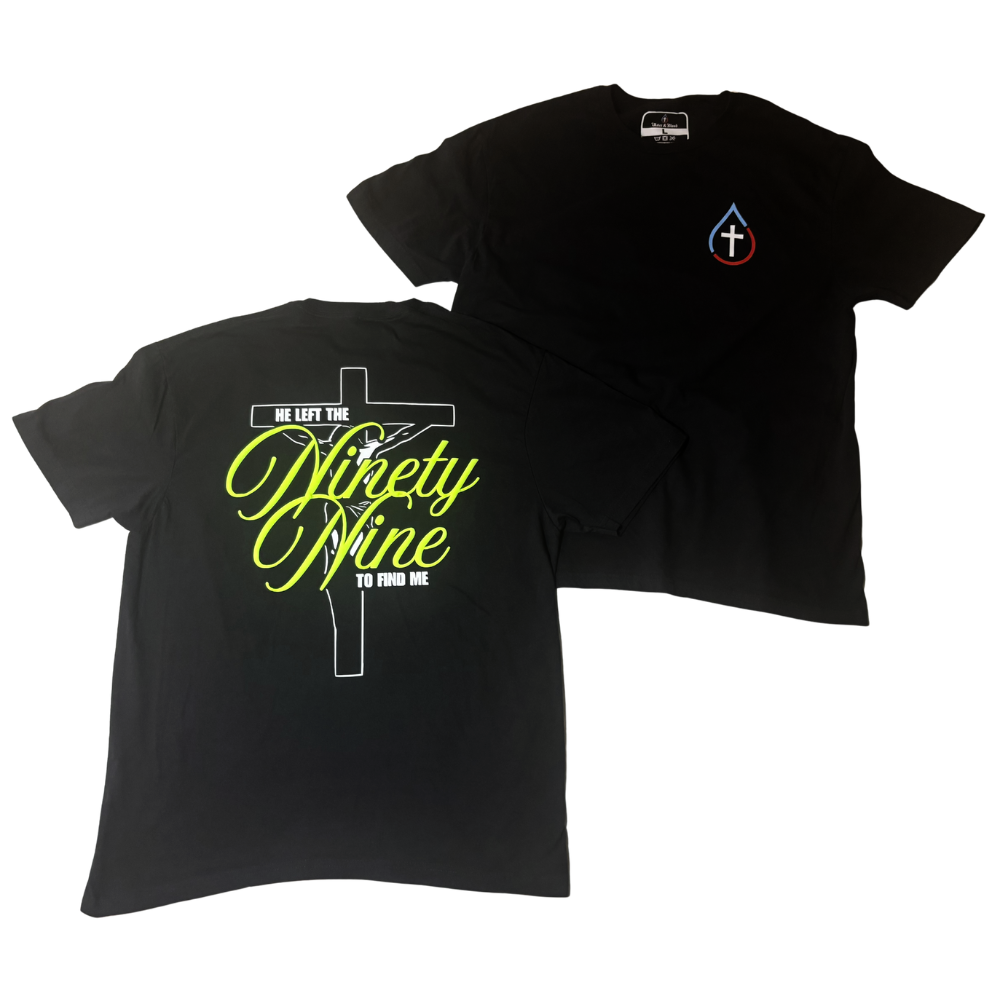 Two black short-sleeve T-shirts shown on a white background, with the back view in front featuring a large white cross graphic and bright yellow text reading 'Ninety Nine' and smaller white text 'He Left the (Ninety Nine) To Find Me,' and the front view behind showing a small multicolor cross logo on the left chest.